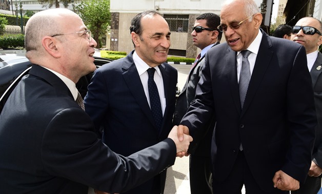 FILE - Parliament Speaker Ali Abdelaal shakes hands with his Moroccan counterpart