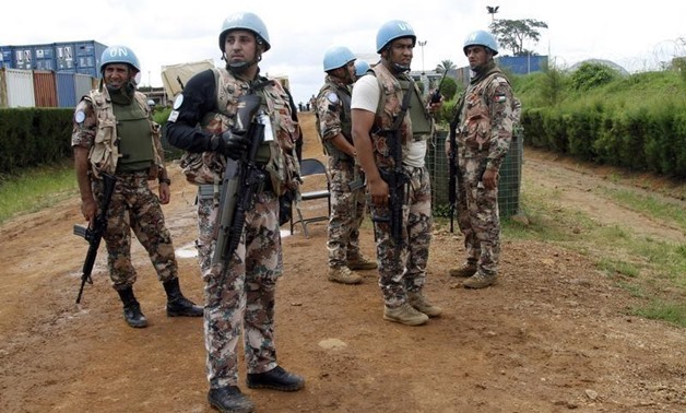 U.N. peacekeepers hold position at the MONUSCO base after dispersing demonstrators in Mavivi near Beni in North Kivu province October 22, 2014. REUTERS