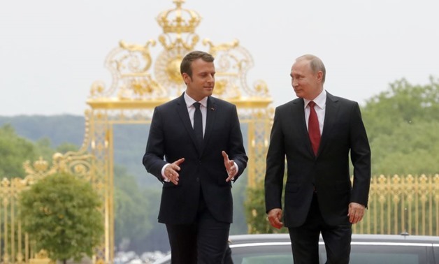 French President Emmanuel Macron and Russia's Vladimir Putin - File Photo
