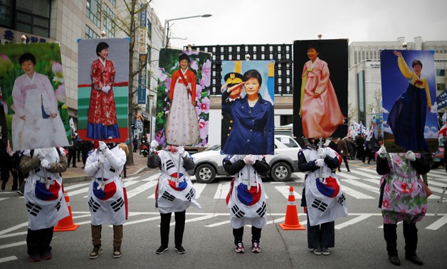 Supporters of ousted President Park Geun-hye gather outside a court after a South Korean court jailed her for 24 years, in Seoul, South Korea, April 6, 2018. REUTERS/Kim Hong-Ji