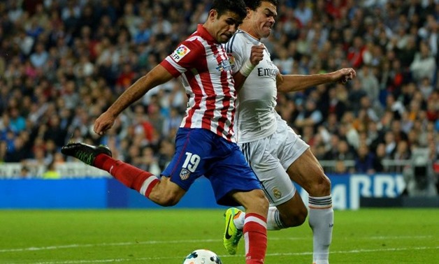 Diego Costa will play in his seventh Madrid derby in La Liga on Sunday - in his last (pictured) in 2013 he scored the winner for Atletico AFP/File / GERARD JULIEN
