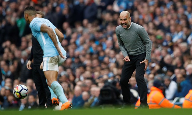 Soccer Football - Premier League - Manchester City vs Manchester United - Etihad Stadium, Manchester, Britain - April 7, 2018 Manchester City manager Pep Guardiola looks on as Manchester City's Danilo is in action Action Images via Reuters/Lee Smith 