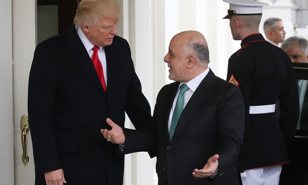 President Donald Trump, left, greets Iraqi Prime Minister Haider al-Abadi upon his arrival to the White House in Washington, March 20, 2017 - Mark Wilson/Getty 