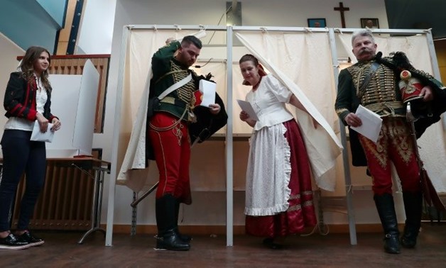 Turnout was high in Hungary's election, where some polling stations had to stay open late to accommodate the large number of voters
