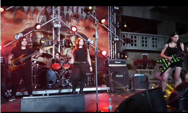 Screencap from a video showing the band performing live, April 8, 2018 – Youtube/Metal Muse.