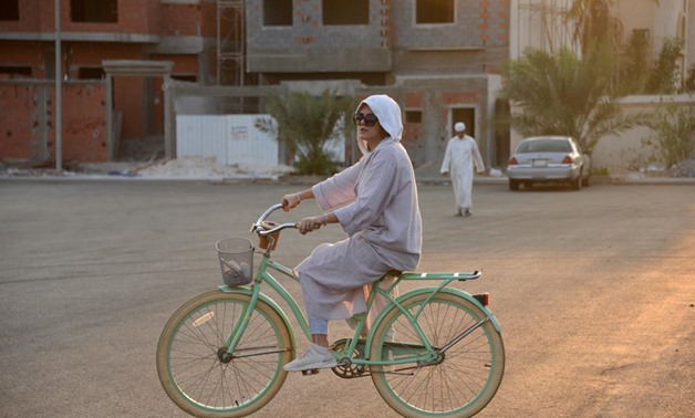 Amirah al-Turkistani, a graphic design lecturer at Jeddah International College, rides her bicycle in Jeddah, Saudi Arabia, November 7, 2017. REUTERS/Reem Baeshen
