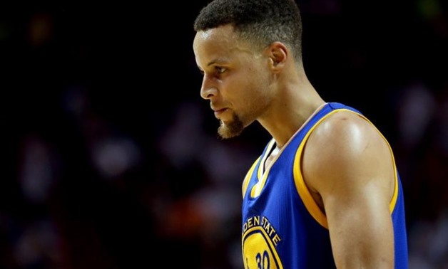 Golden State Warriors guard Stephen Curry (30) looks on against the Miami Heat during the second half at American Airlines Arena. Mandatory Credit: Steve Mitchell-USA TODAY Sports
