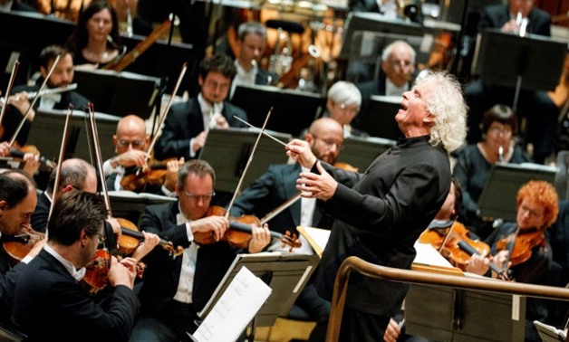 The London Symphony Orchestra's Music Director, Simon Rattle, leads a performace at The Barbican
