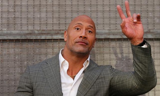Cast member Dwayne Johnson poses at the premiere for the movie "Rampage" in Los Angeles, California, U.S., April 4, 2018. REUTERS/Mario Anzuoni
