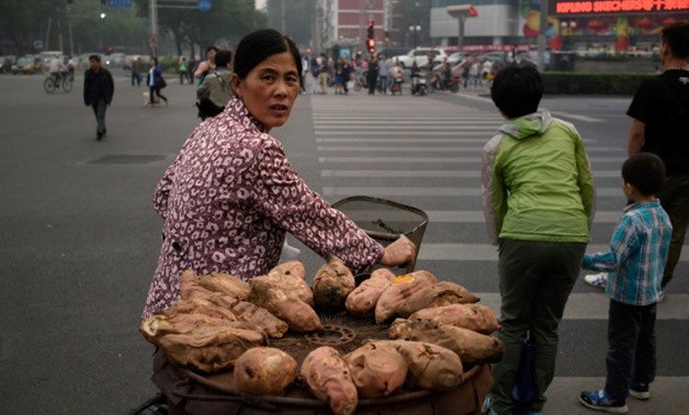 How sweet potatos, seen here hauled by a street vendor in Bejing, spread from South America to Polynesia centuries ago is the subject of a new study that concludes that wind-borne seeds is the likely explanation
