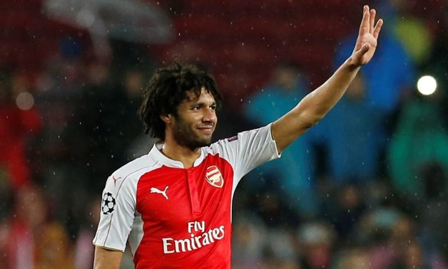 Arsenal's Mohamed Elneny waves to fans after the game. Football Soccer - FC Barcelona v Arsenal - UEFA Champions League Round of 16 Second Leg - The Nou Camp, Barcelona, Spain - 16/3/16 Reuters / Albert GeaLivepic