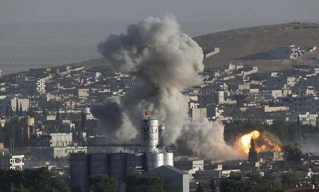 FILE: Smoke rises after a U.S.-led air strike in the Syrian town of Kobani Ocotber 10, 2014. Reuters
