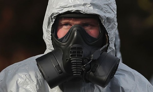 A meticulous clean-up has now begun in Salisbury after the poisoning of a former Russian spy. Emergency services workers, seen here in March, have sometimes had to wear protective clothing and breathing equipment
