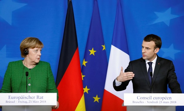 German Chancellor Angela Merkel and France's President Emmanuel Macron hold joint news conference at a European Union leaders summit in Brussels, Belgium, March 23, 2018. REUTERS/Francois Lenoir/File Photo