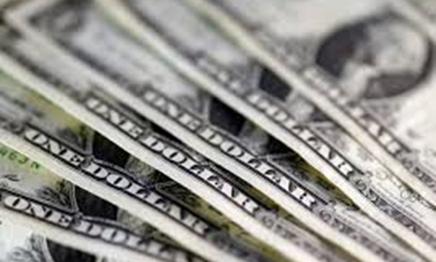 U.S. dollar notes are seen in this November 7, 2016 picture illustration. REUTERS/Dado Ruvic/Illustration/File Photo

