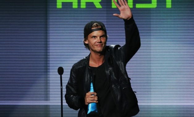 Avicii accepts the favorite electronic dance music artist award at the 41st American Music Awards in Los Angeles, California November 24, 2013. REUTERS/Lucy Nicholson