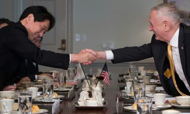 US Secretary of Defense Jim Mattis shakes hands with Japanese Defense Minister Itsunori Onodera during a meeting at the Pentagon
