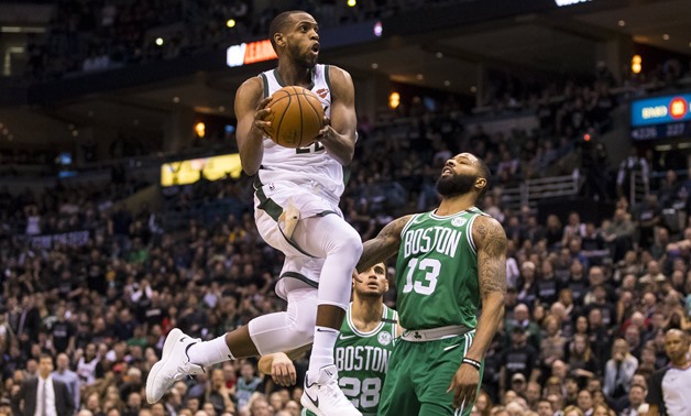 Apr 20, 2018; Milwaukee, WI, USA; Milwaukee Bucks forward Khris Middleton (22) drives for a shot over Boston Celtics forward Marcus Morris (13) during the fourth quarter in game three of the first round of the 2018 NBA Playoffs at BMO Harris Bradley Cente