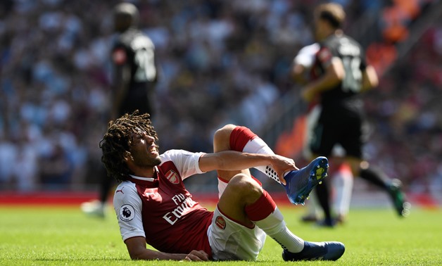 Soccer Football - Premier League - Arsenal v West Ham United - Emirates Stadium, London, Britain - April 22, 2018 Arsenal'sMohamed Elneny reacts after sustaining an injury Action Images via Reuters/Tony O'Brien 