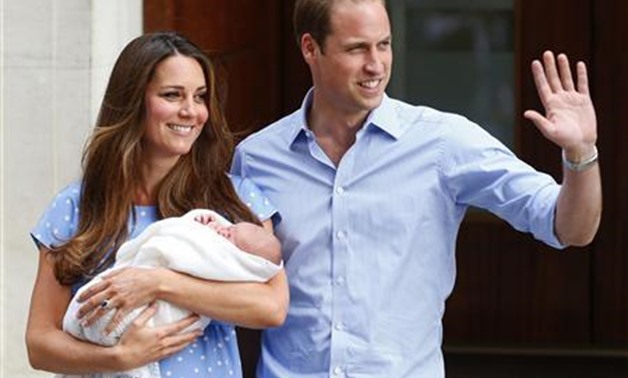Britain's Prince William and his wife Catherine, Duchess of Cambridge appear with their baby son outside the Lindo Wing of St Mary's Hospital, in central London July 23, 2013. REUTERS/Andrew Winning