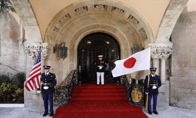  United States Marines stand guard at the front door of U.S. President Donald Trump’s Mar-a-Lago estate with U.S. and Japanese flags as they await the arrival of Japan’s Prime Minister Shinzo Abe for a bilateral meeting in Palm Beach, Florida U.S., April 
