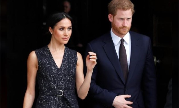 Britain's Prince Harry and his fiancee Meghan Markle leave a service at St Martin-in-The Fields to mark 25 years since Stephen Lawrence was killed in a racially motivated attack, in London, Britain, April 23, 2018. REUTERS/Peter Nicholls