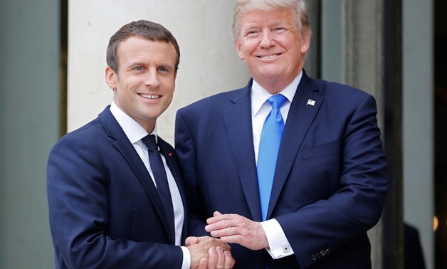French President Emmanuel Macron greets U.S. President Donald Trump at the Elysee Palace in Paris, France, July 13, 2017. REUTERS/Stephane Mahe. “
