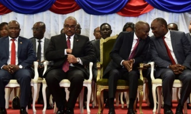 © AFP/File | Haitian President Jovenel Moise (C-R) and Prime Minister Jack Guy Lafontant (C-L), at Lafontant's investiture in March 2017
