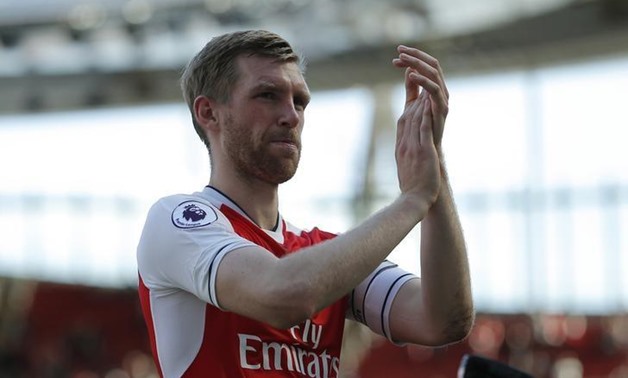 FILE PHOTO: Britain Football Soccer - Arsenal v Everton - Premier League - Emirates Stadium - 21/5/17 Arsenal's Per Mertesacker applauds fans after the match Action Images via Reuters / Andrew Couldridge Livepic
