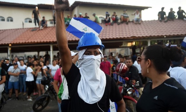People demonstrate demanding Nicaraguan President Daniel Ortega and his wife, Vice-President Rosario Murillo, step down after deadly unrest
