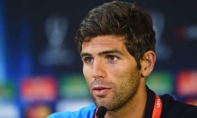 Sevilla's Federico Fazio talks during a news conference ahead of the team's UEFA Super Cup soccer match against Real Madrid at Cardiff City Stadium, Wales, August 11, 2014. REUTERS/UEFA/Pool 

