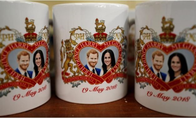 Mugs commemorating the wedding of Britain's Prince Harry and Meghan Markle are seen at the Prince William Pottery Company in Liverpool, Britain April 23, 2018. Picture taken April 23, 2018. REUTERS/Phil Noble