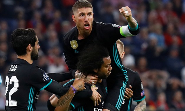 Soccer Football - Champions League Semi Final First Leg - Bayern Munich vs Real Madrid - Allianz Arena, Munich, Germany - April 25, 2018 Real Madrid's Marcelo celebrates scoring their first goal with Sergio Ramos and Isco REUTERS/Kai Pfaffenbach TPX IMAGE