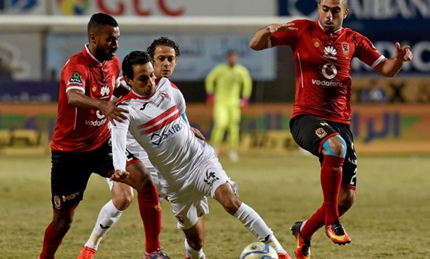 Zamalek's Ayman Hefni vies for the ball against al-Ahly's Ahmed Fathy and Hossam Ashour, AFP