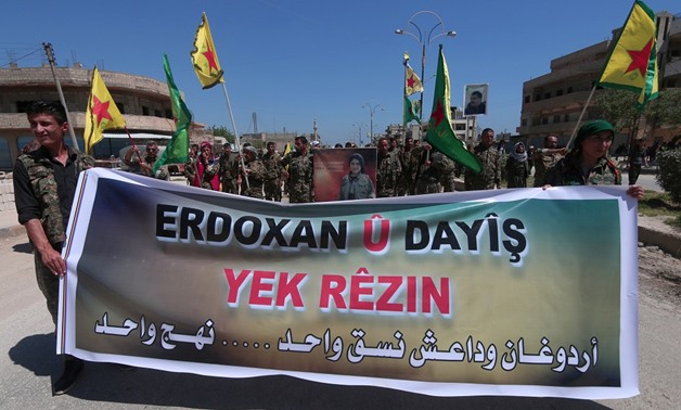 Kurdish fighters protest against Turkish airstrikes on their headquarters in Mount Karachok - AFP