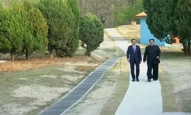 South Korean President Moon Jae-in and North Korean leader Kim Jong Un attend the inter-Korean summit at the truce village of Panmunjom, in this still frame taken from video, South Korea April 27, 2018. Host Broadcaster via REUTERS TV