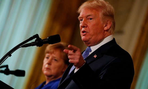 U.S. President Donald Trump and Germany's Chancellor Angela Merkel hold a joint news conference in the East Room of the White House in Washington, U.S., April 27, 2018. REUTERS/Brian Snyder
