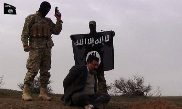 A man is executed in a new video released by ISIS - Reuters
