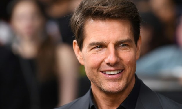 Actor Tom Cruise, seen here at a fan event in New York on June 6, 2017, says shattering an ankle while making "Mission Impossible -- Fallout" was tough but "I didn't want to stop filming".