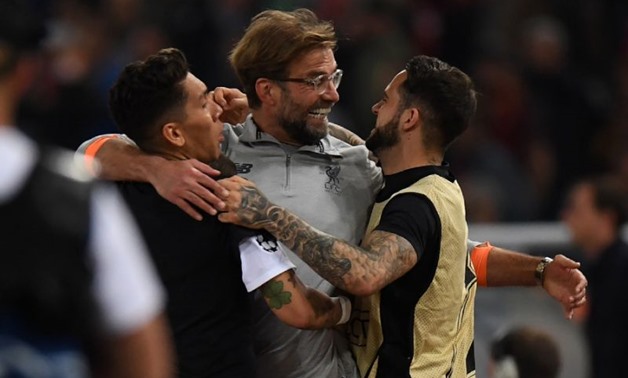 Manager Jurgen Klopp, celebrating with Roberto Firmino and Danny Ings, has led Liverpool into their eighth European Cup or Champions League final
