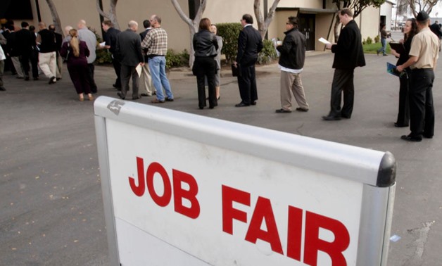 FILE- A job fair at Peterson Air Force Base, Colo, draws a crowd Sept. 1. Stand out as a potential employee by working ahead through the Spouse Education and Career Opportunities Program. Their online portal is a service that can link spouses with jobs be