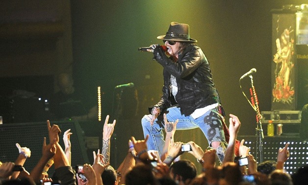 Singer Axl Rose of Guns N' Roses, shown at a 2012 performance, reunited with guitarist Slash in 2016 for a tour that has been repeatedly extended.