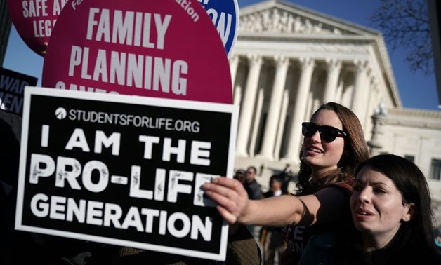 An Iowa bill banning abortions once a fetal heartbeat is detected is expcted to trigger a legal battle, which conservatives hope will land the flashpoint social issue back at the US Supreme Court
