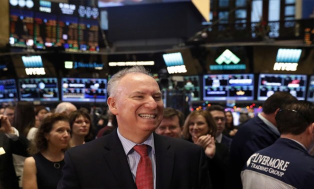 Xerox chief executive officer, Jeff Jacobson (L), smiles as he stands on the floor of the New York Stock Exchange (NYSE) in New York, U.S., January 4, 2017. REUTERS/Lucas Jackson