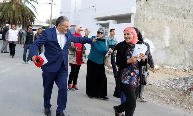 Simon Salama, a Tunisian Jew and 52-year old candidate from the Islamist Ennahda Party in the municipal elections, distributes leaflets in Monastir, Tunisia May 3, 2018. Picture taken May 3, 2018. REUTERS/Zoubeir Souissi
