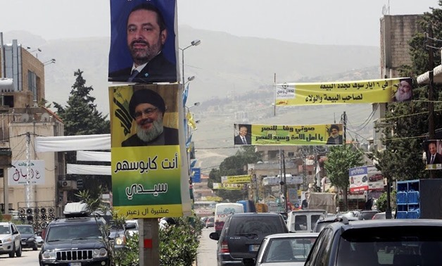 Posters of Lebanese Prime Minister and candidate for parliamentary election Saad al-Hariri, above, and Lebanon's Hezbollah leader Sayyed Hassan Nasrallah hang on poles along a street in Zahle, Lebanon, on May 4, 2018. Picture: REUTERS/AZIZ TAHER