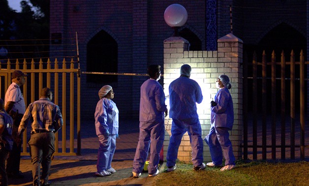 Police investigators collect evidence at a mosque where three men were attacked in Ottawa, South Africa, May 10, 2018. REUTERS/Rogan Ward