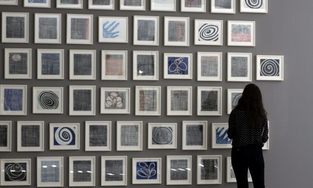 A woman looks at "Je t'aime" (2005), a series of 60 double-sided drawings by Louise Bourgeois, at Glenstone museum in Potomac, Maryland on May 8, 2018.
