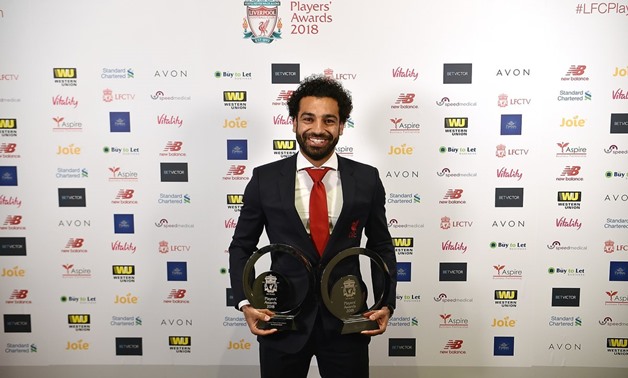 Salah with two of his awards on Thursday - Courtesy of Liverpool's official Twitter account