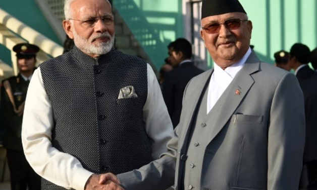 Nepali Prime Minister K.P Sharma Oli greets Indian Prime Minister Narendra Modi, who has cast his visit as part of his "neighbourhood first" policy
